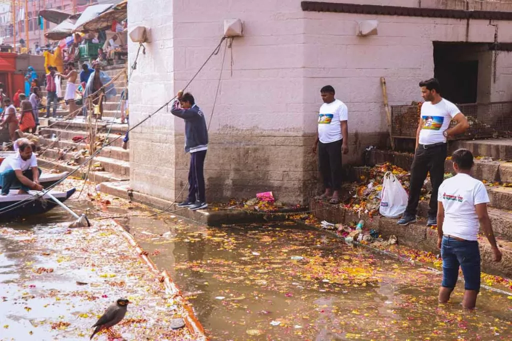 Volunteer to clean ghats in Varanasi