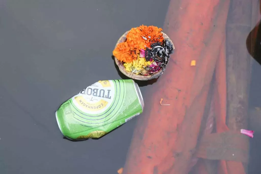 cleaning ganges by not throwing garbage into it