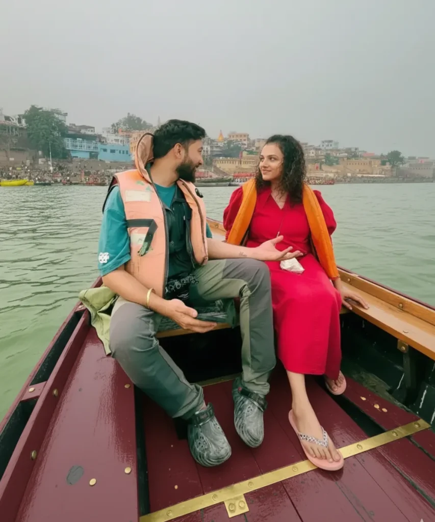 Couple wearing life jackets on a Varanasi Guru boat on the Ganga