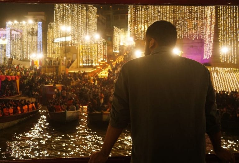 Dev Diwali in Varanasi seen from a boat on the Ganga, with lit ghats and diyas along the river